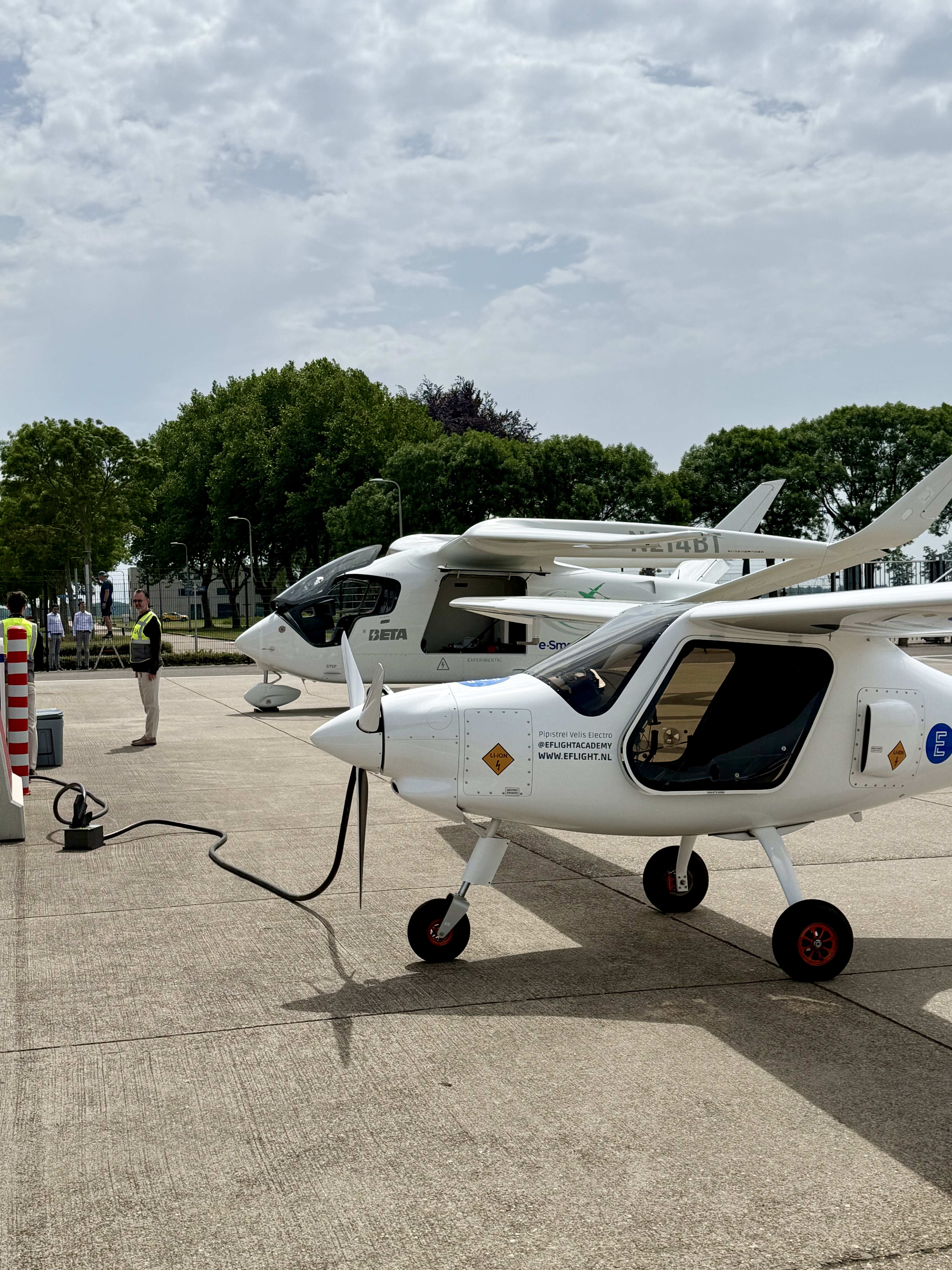 Electric aircraft being charged on the apron at Lelystad Airport